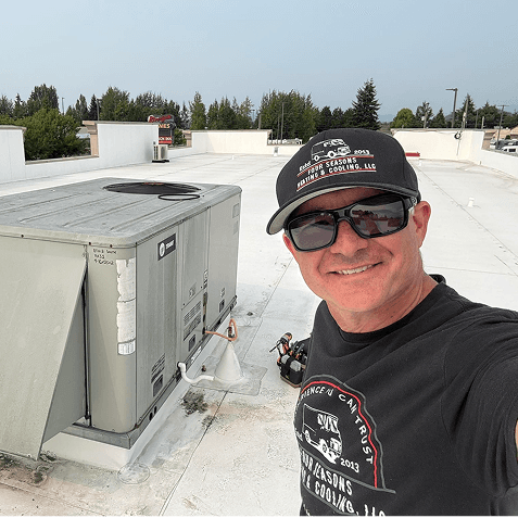 Aaron showing his work on top of a roof